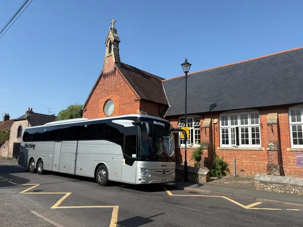 Coach outside School